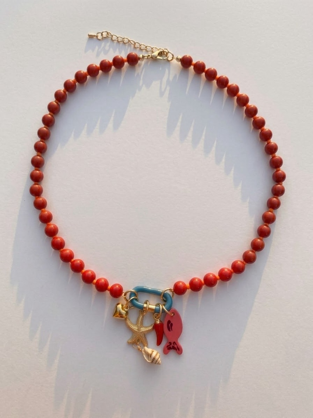 Handcrafted Red Beaded Charm Necklace with Gold Accents